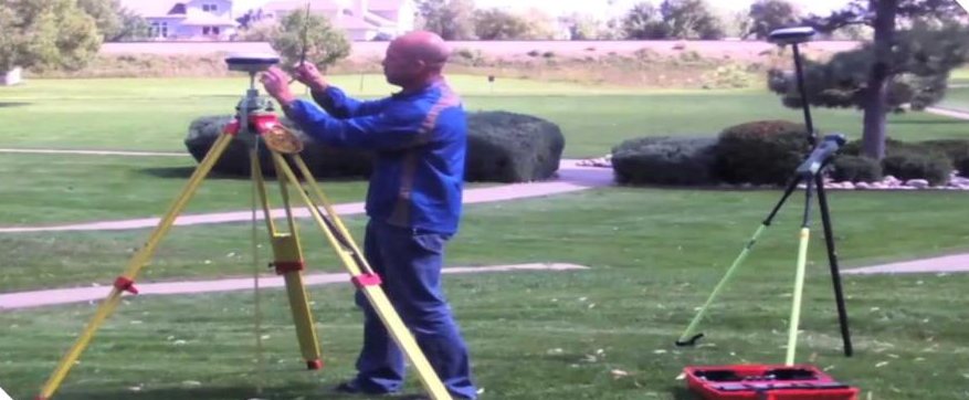 Surveyor setting up DGPS in a field